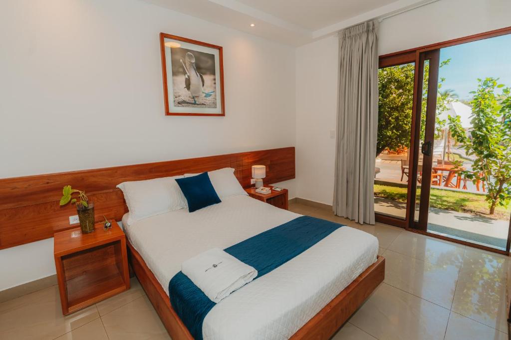 Postel nebo postele na pokoji v ubytování Hotel Ninfa