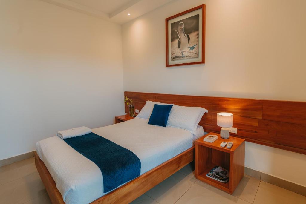 Postel nebo postele na pokoji v ubytování Hotel Ninfa