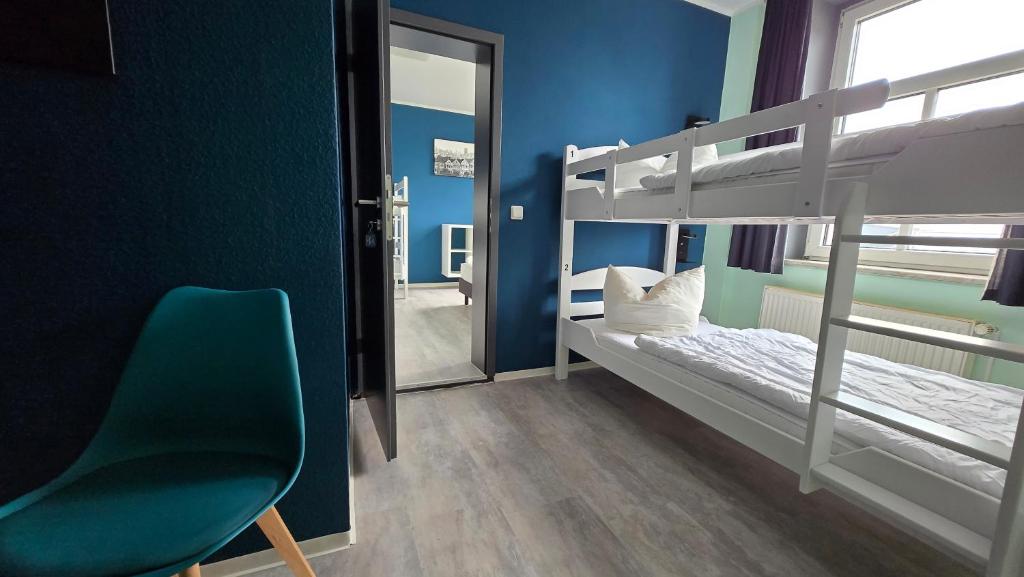 Letto o letti in una camera di Harz Hostel
