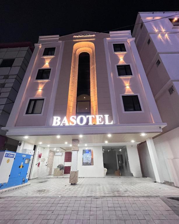 a building with a sign on the front of it at Basotel Hotel Indore Vijaynagar in Indore