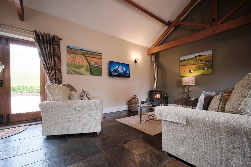 Posezení v ubytování Swallows Nest Cottage