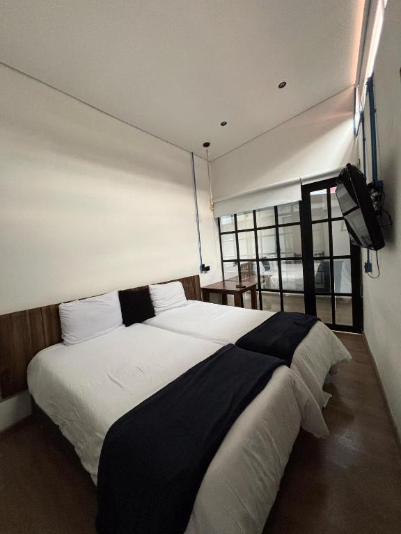 Postel nebo postele na pokoji v ubytování Hotel Quinta Bolivar