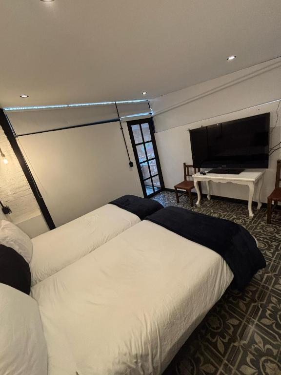 Postel nebo postele na pokoji v ubytování Hotel Quinta Bolivar