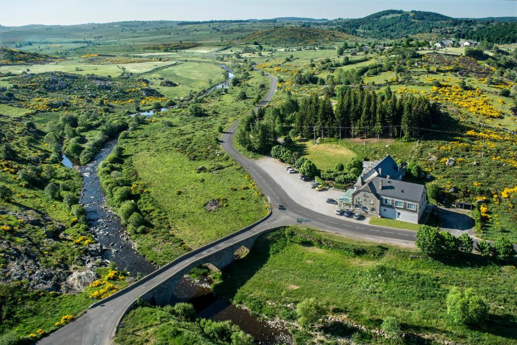 an aerial view of a house and a road at Le Relais de l'Aubrac in Nasbinals