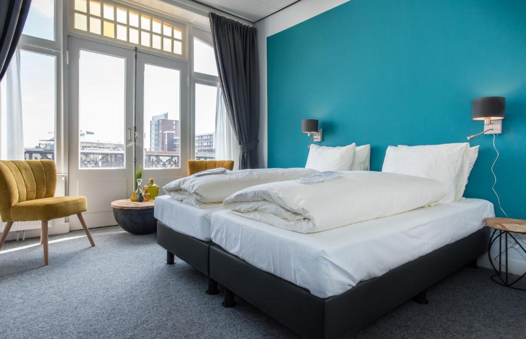 Postel nebo postele na pokoji v ubytování Villahotel Vlissingen