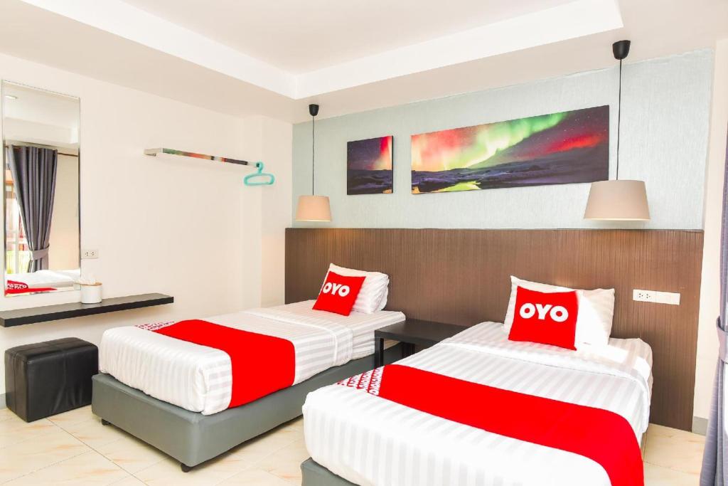 Postel nebo postele na pokoji v ubytování OYO 394 Nana Beach Cha Am