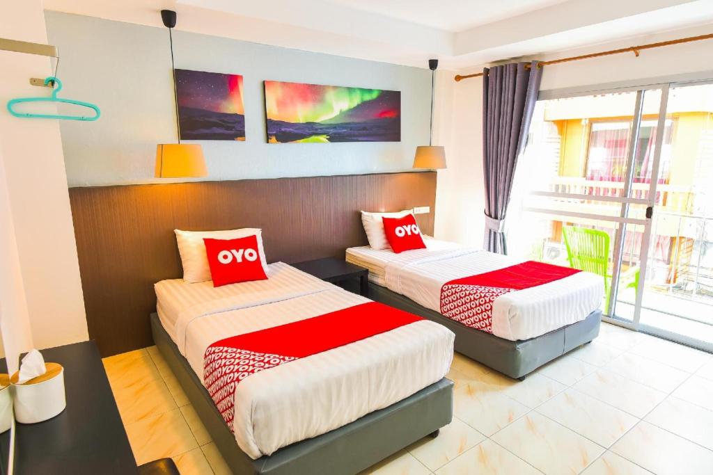 Postel nebo postele na pokoji v ubytování OYO 394 Nana Beach Cha Am