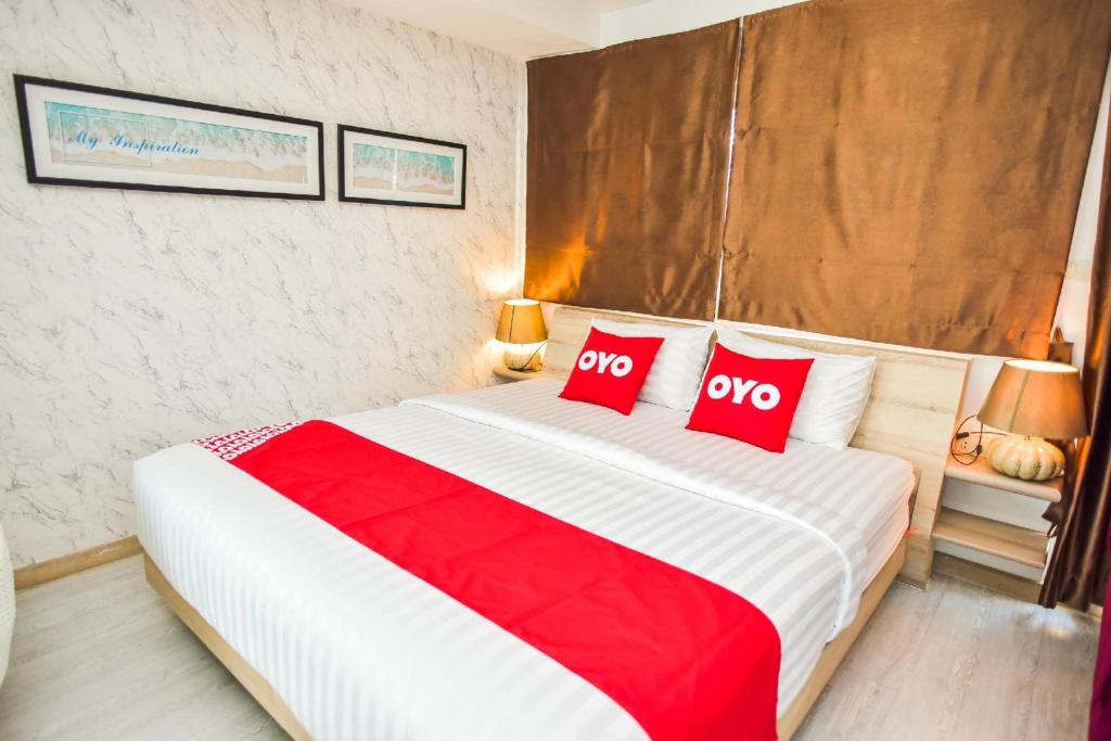 Postel nebo postele na pokoji v ubytování OYO 394 Nana Beach Cha Am