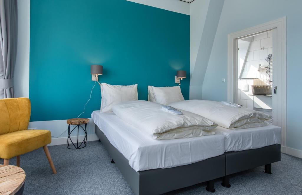 Postel nebo postele na pokoji v ubytování Villahotel Vlissingen