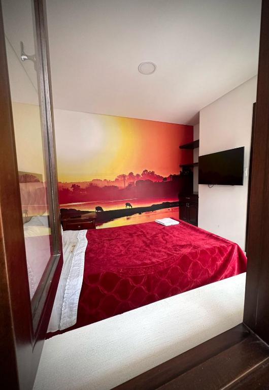 Postel nebo postele na pokoji v ubytování Hotel Chicala