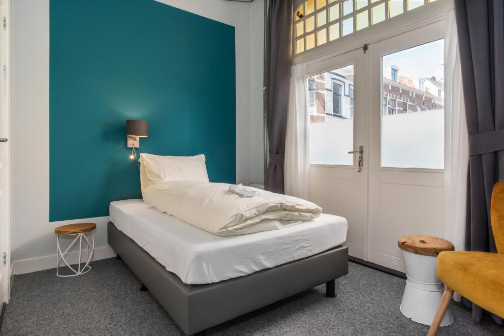 Postel nebo postele na pokoji v ubytování Villahotel Vlissingen
