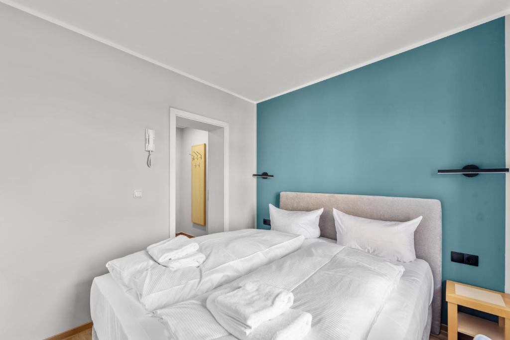 Postel nebo postele na pokoji v ubytování Hotel Friedrichstadt