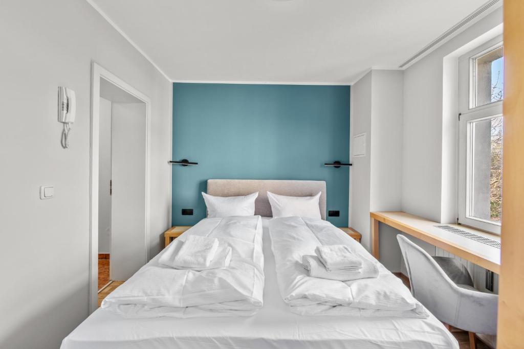 Postel nebo postele na pokoji v ubytování Hotel Friedrichstadt