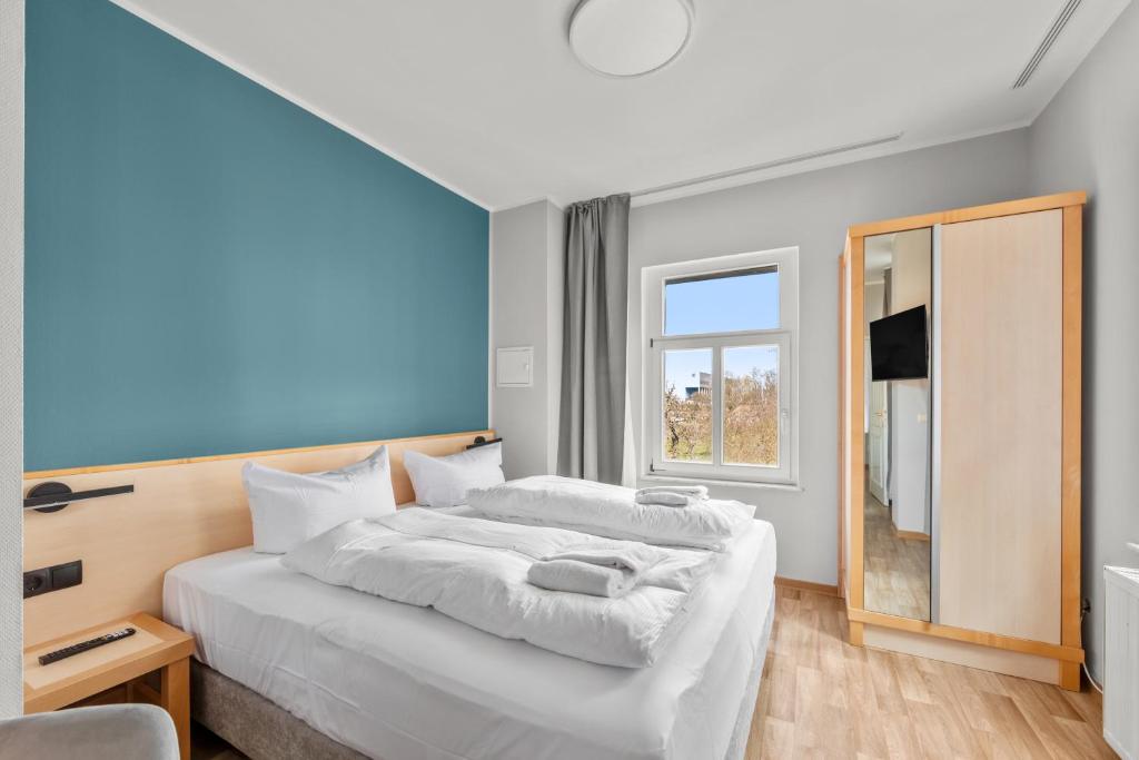 Postel nebo postele na pokoji v ubytování Hotel Friedrichstadt