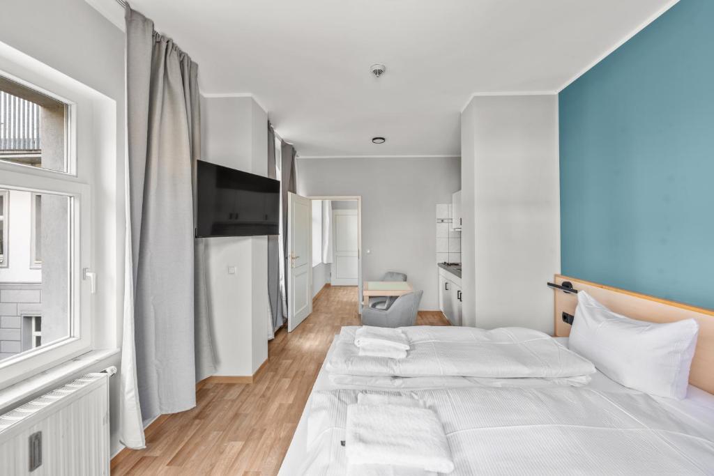 Postel nebo postele na pokoji v ubytování Hotel Friedrichstadt