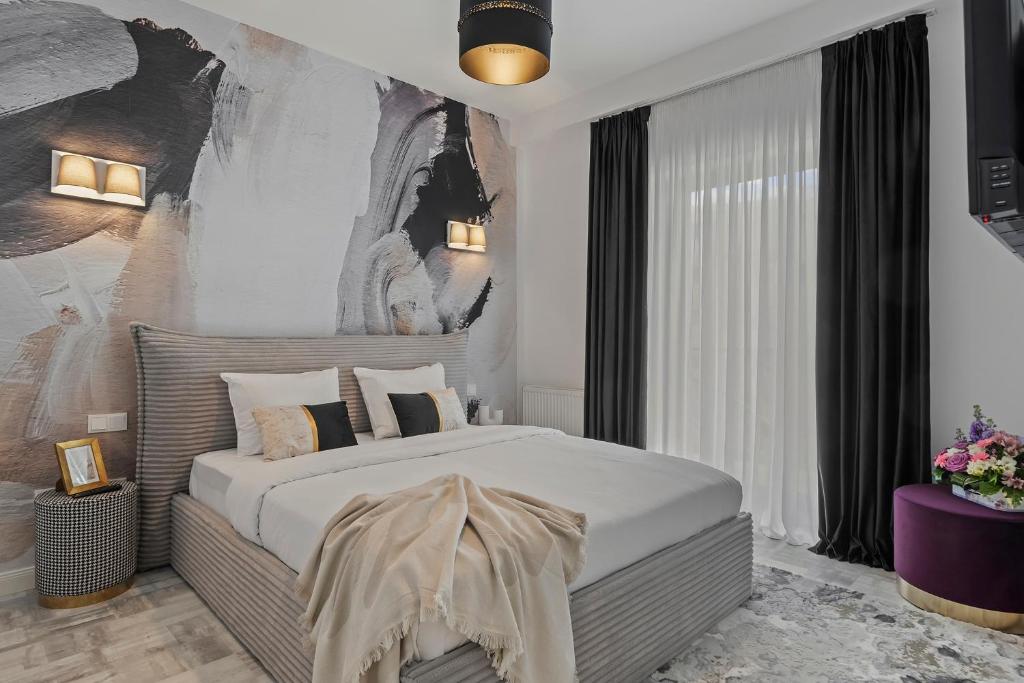 Ένα ή περισσότερα κρεβάτια σε δωμάτιο στο Bucharest Central Apartment