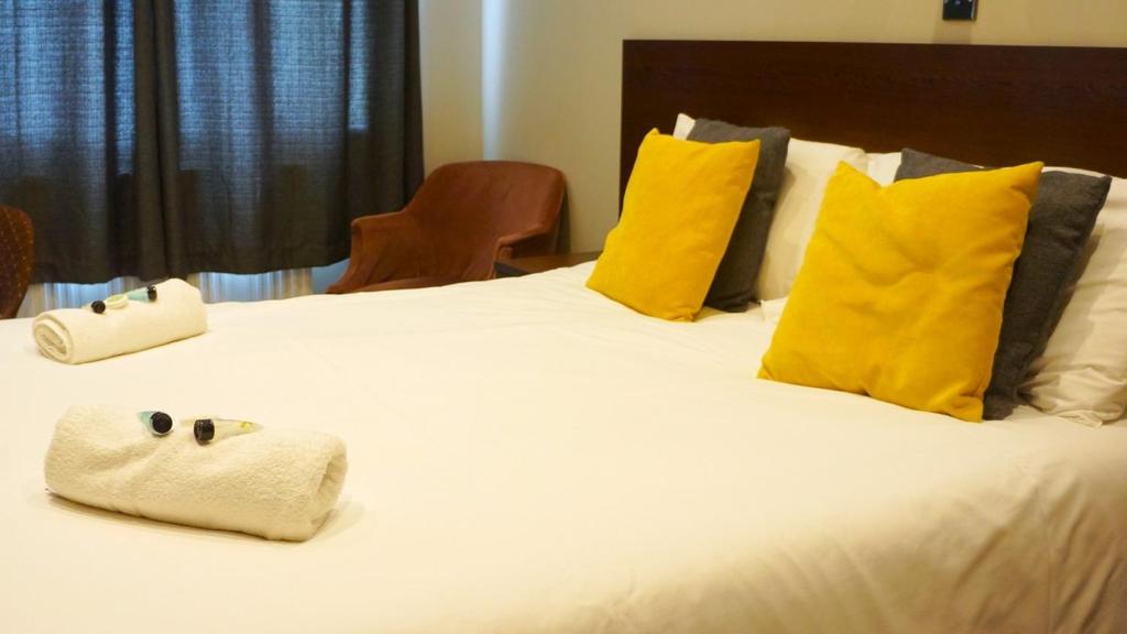 Postel nebo postele na pokoji v ubytování Oban Hotel