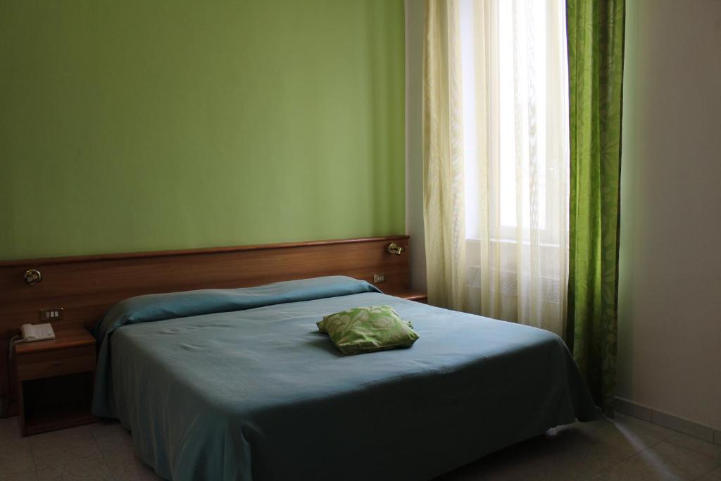 Postel nebo postele na pokoji v ubytování Hotel Santa Marta