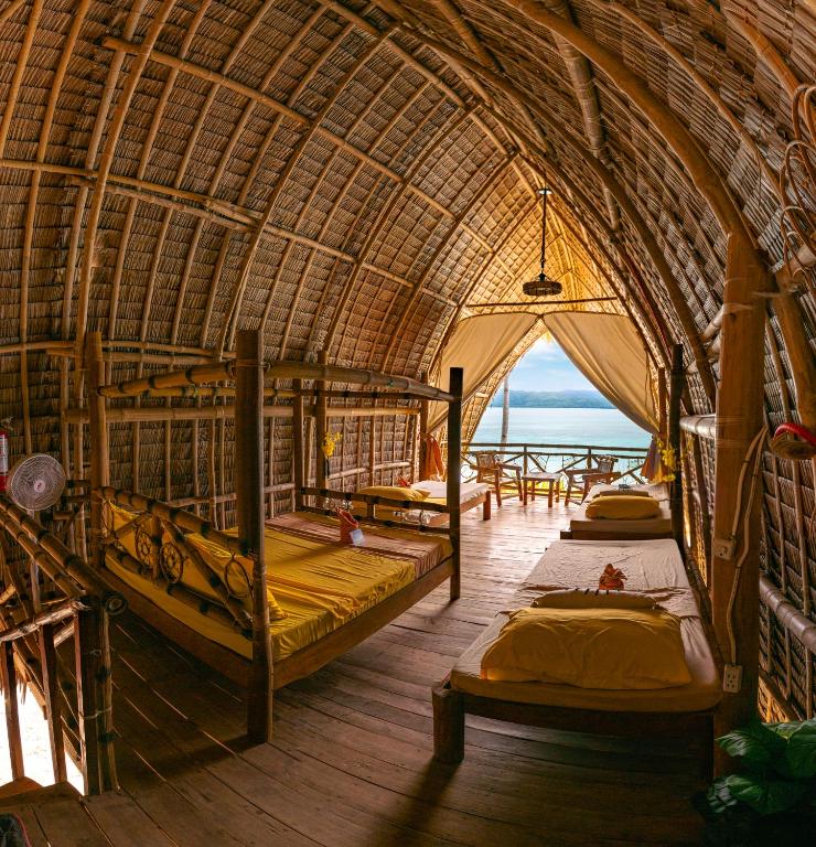 Postel nebo postele na pokoji v ubytování Isla - The Island Experience