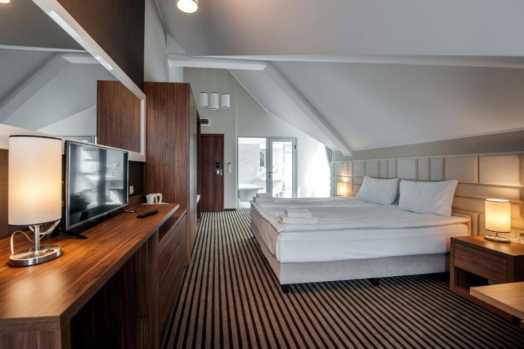 Postel nebo postele na pokoji v ubytování Hotel White