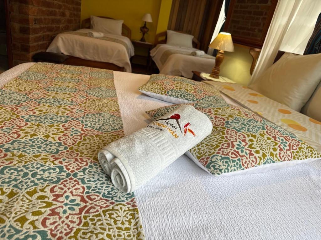 Postel nebo postele na pokoji v ubytování Hotel Donde Ivan