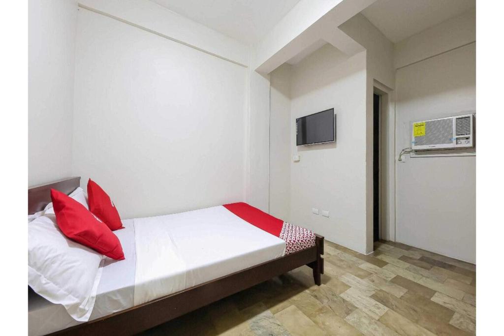 Postel nebo postele na pokoji v ubytování Cittatel Inn