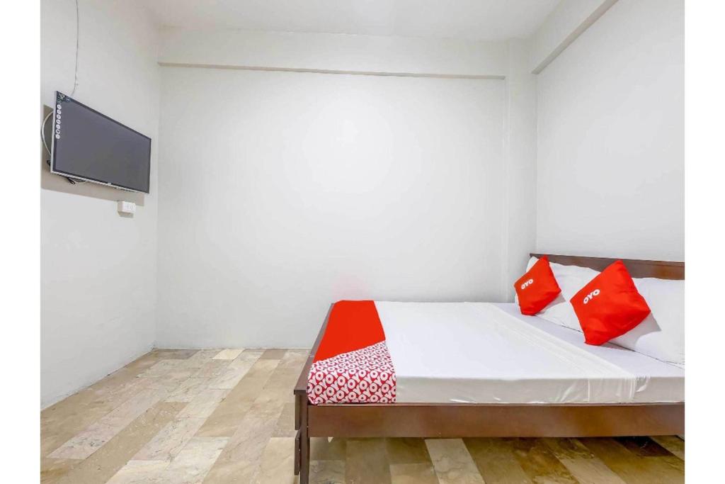 Postel nebo postele na pokoji v ubytování Cittatel Inn