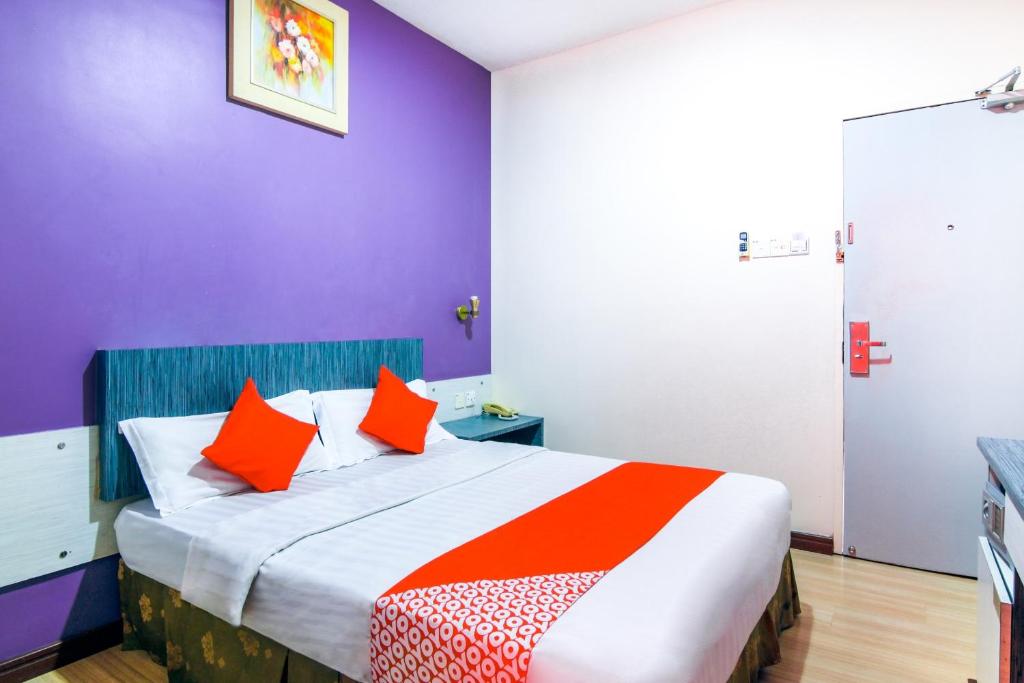 Postel nebo postele na pokoji v ubytování Super OYO 43930 Hotel Esplanade