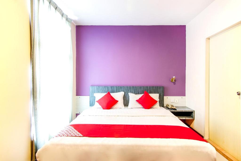 Postel nebo postele na pokoji v ubytování Super OYO 43930 Hotel Esplanade