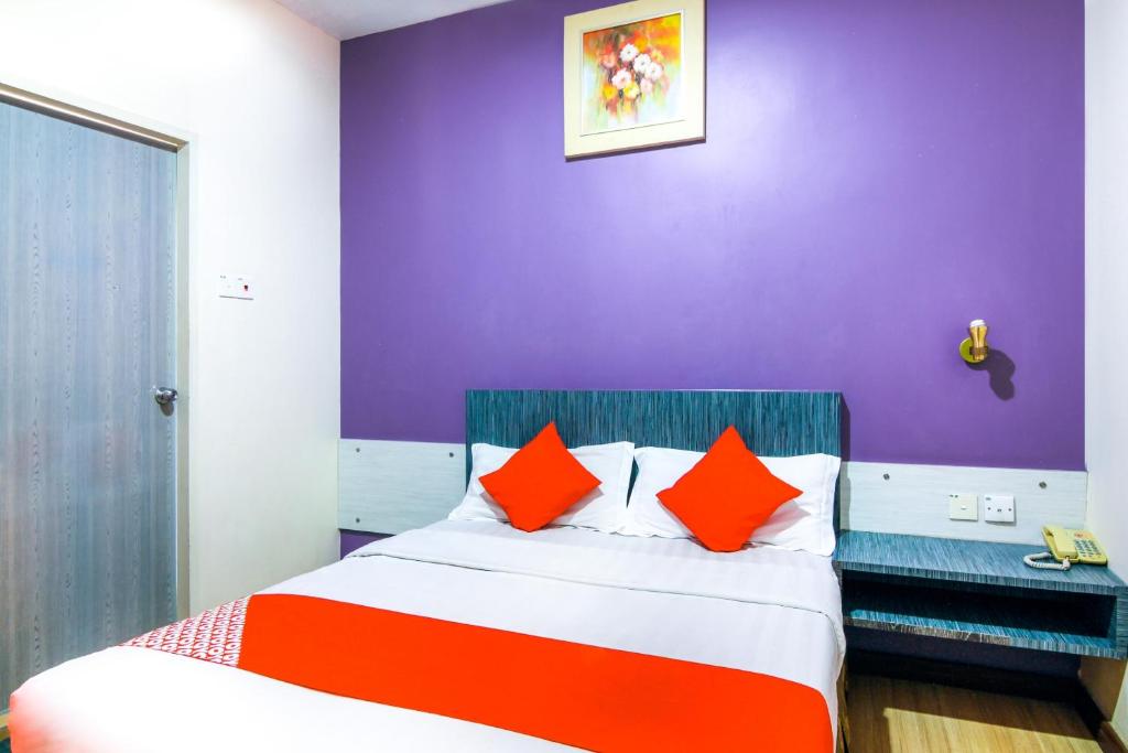 Postel nebo postele na pokoji v ubytování Super OYO 43930 Hotel Esplanade