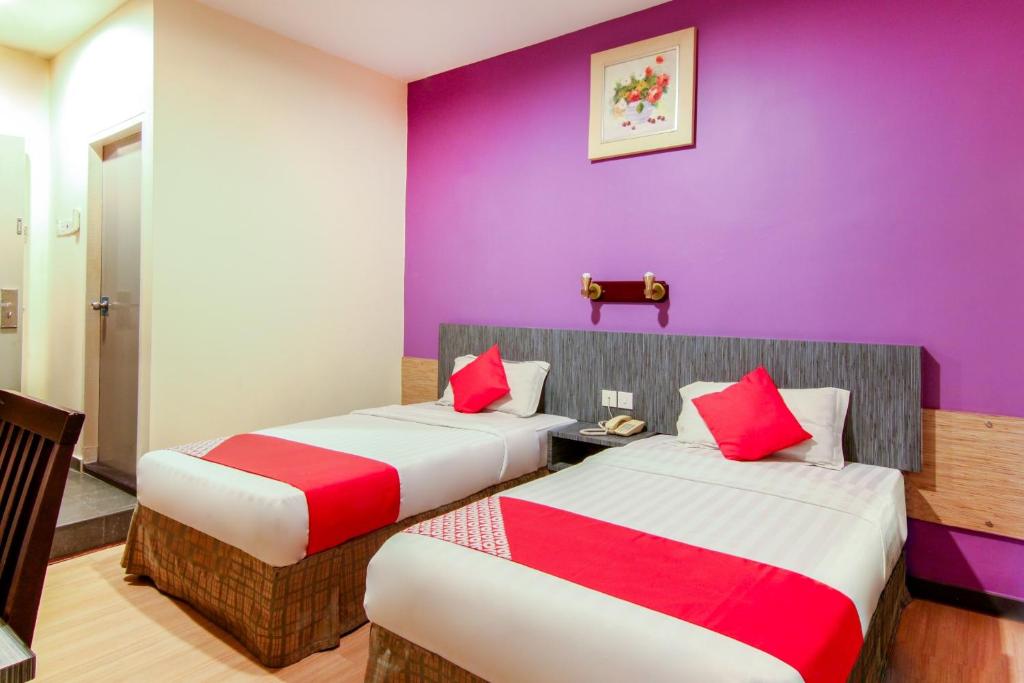 Postel nebo postele na pokoji v ubytování Super OYO 43930 Hotel Esplanade