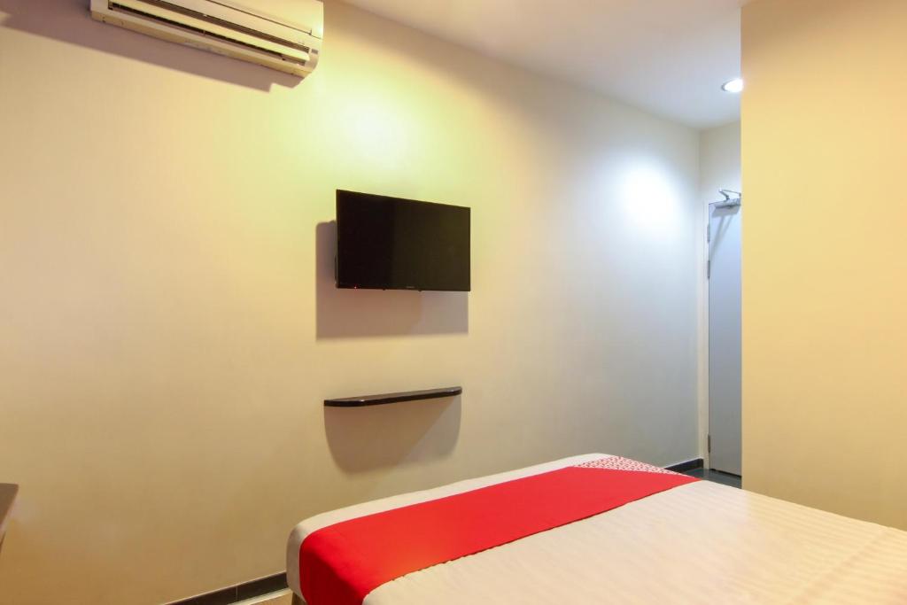 TV a/nebo společenská místnost v ubytování Super OYO 43930 Hotel Esplanade