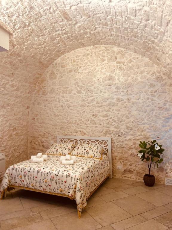 Postel nebo postele na pokoji v ubytování Luxury Suite Of Ostuni