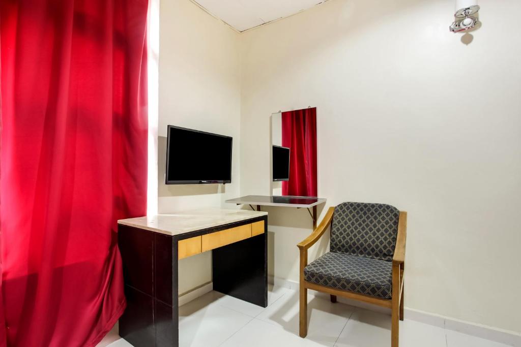 TV a/nebo společenská místnost v ubytování Super OYO 89427 Kavanas Hotel Taiping