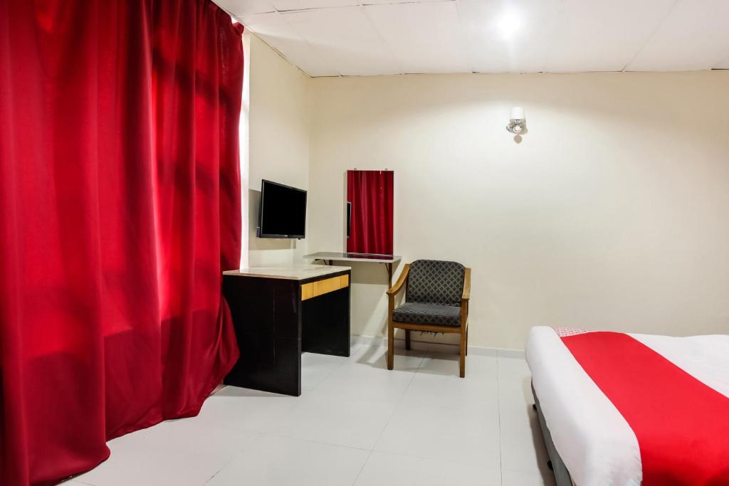 TV a/nebo společenská místnost v ubytování Super OYO 89427 Kavanas Hotel Taiping