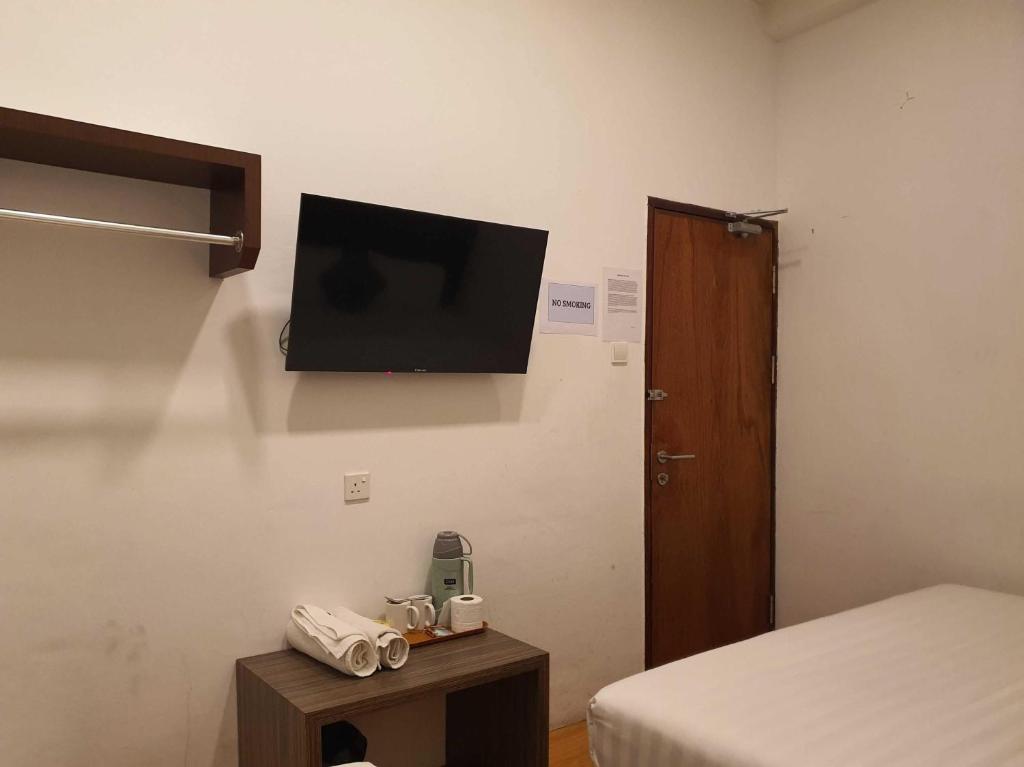 TV a/nebo společenská místnost v ubytování OYO 91053 Signature Inn Miri