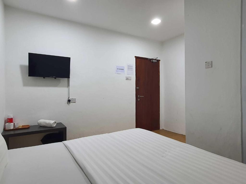TV a/nebo společenská místnost v ubytování OYO 91053 Signature Inn Miri