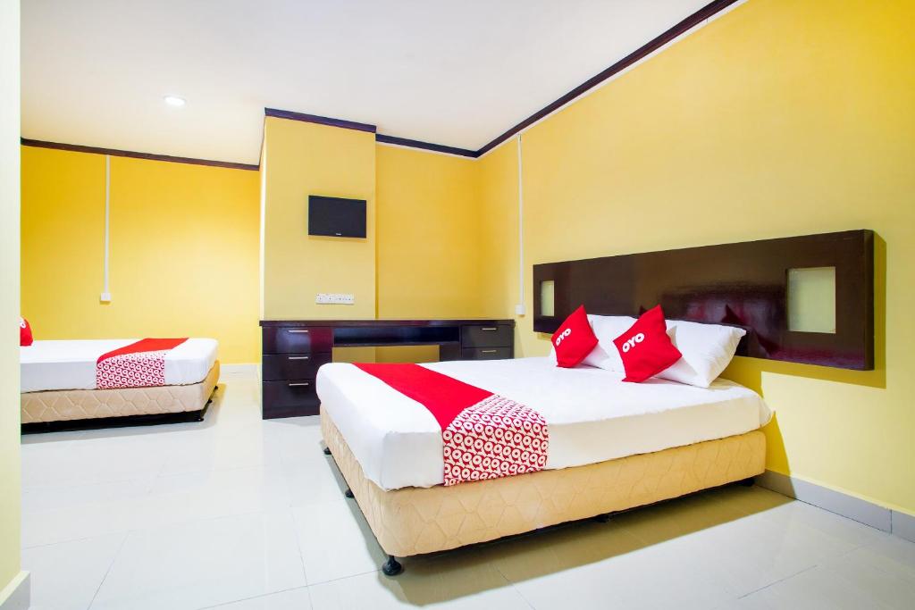 Postel nebo postele na pokoji v ubytování Super OYO 1219 Hotel Bbk