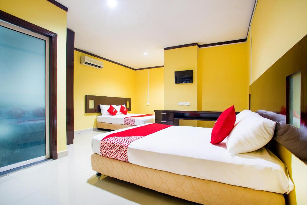 Postel nebo postele na pokoji v ubytování Super OYO 1219 Hotel Bbk