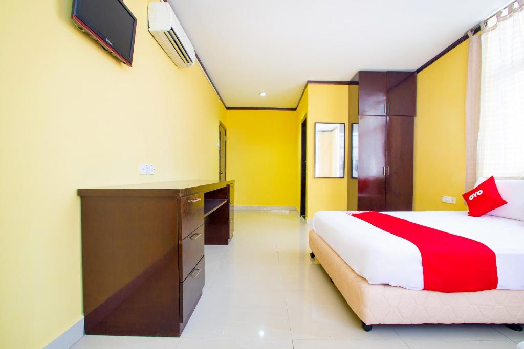 Postel nebo postele na pokoji v ubytování Super OYO 1219 Hotel Bbk
