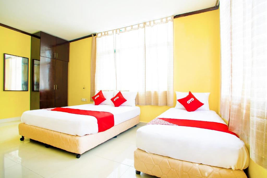 Postel nebo postele na pokoji v ubytování Super OYO 1219 Hotel Bbk