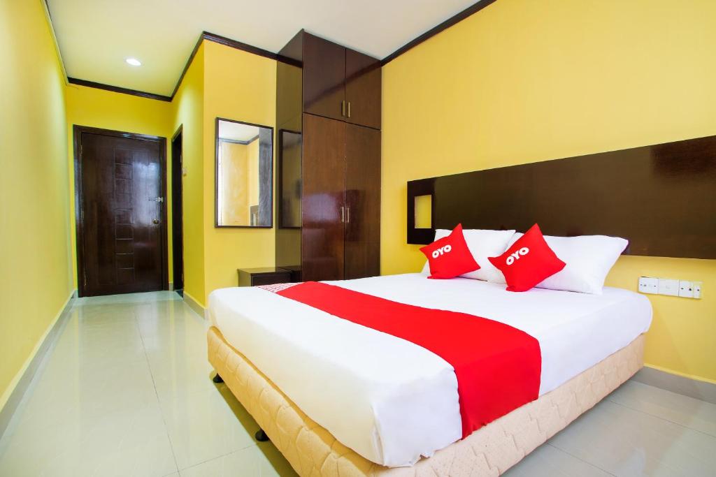 Postel nebo postele na pokoji v ubytování Super OYO 1219 Hotel Bbk