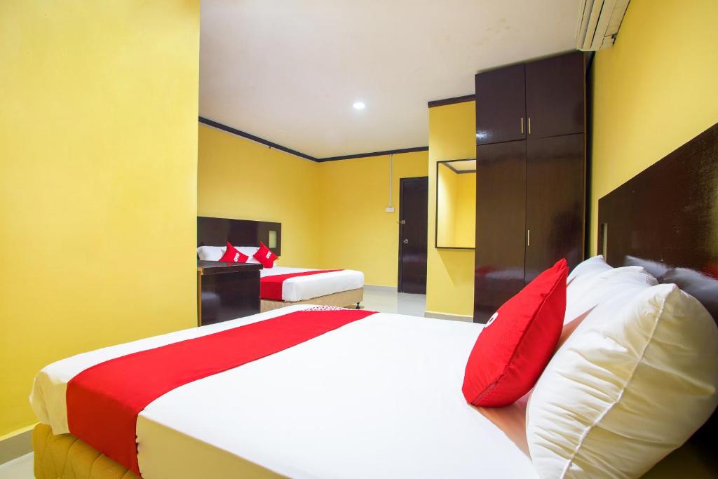 Postel nebo postele na pokoji v ubytování Super OYO 1219 Hotel Bbk
