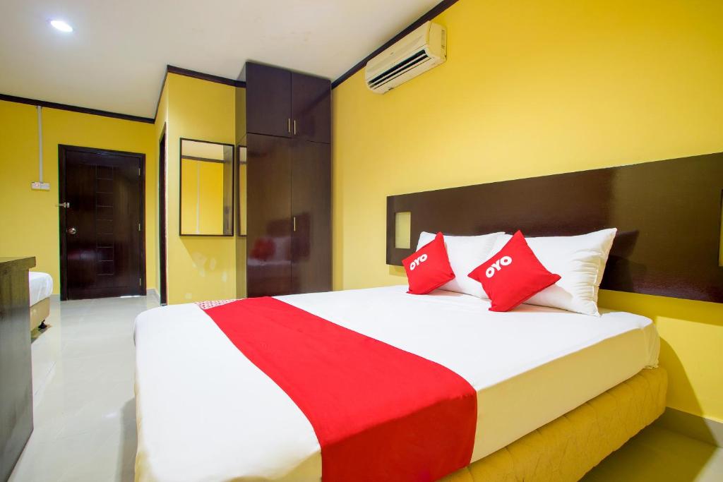 Postel nebo postele na pokoji v ubytování Super OYO 1219 Hotel Bbk