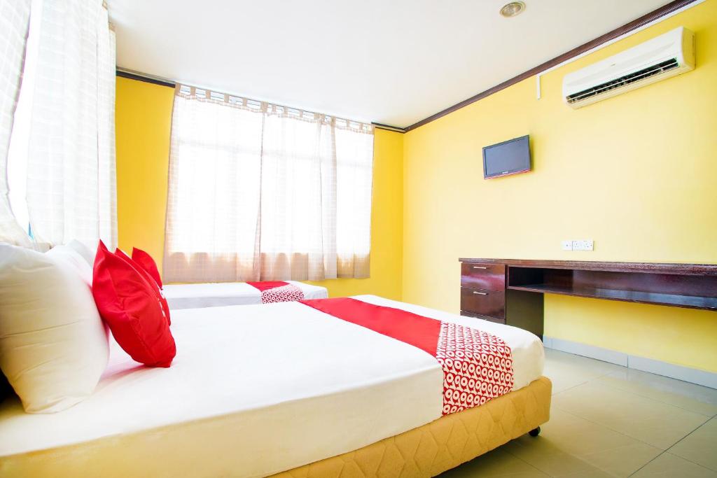 Postel nebo postele na pokoji v ubytování Super OYO 1219 Hotel Bbk