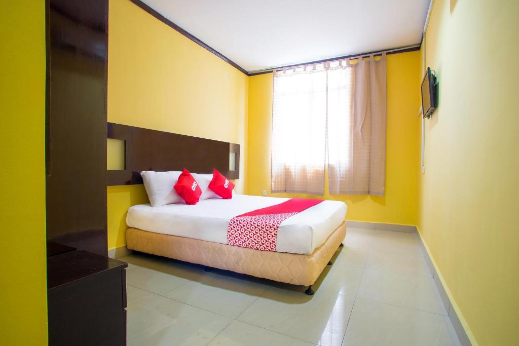 Postel nebo postele na pokoji v ubytování Super OYO 1219 Hotel Bbk