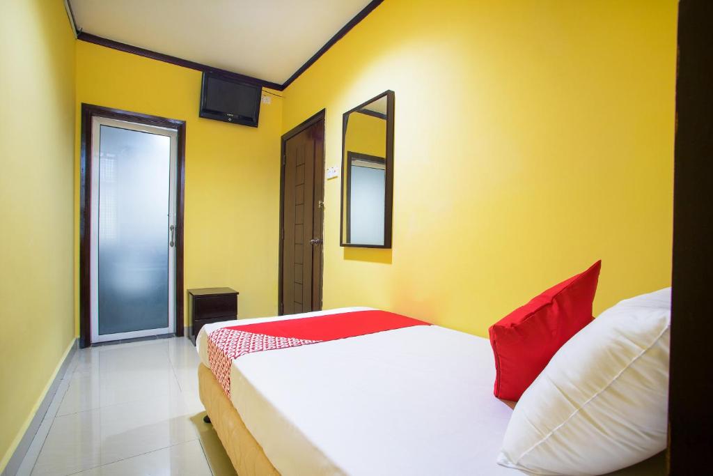 Postel nebo postele na pokoji v ubytování Super OYO 1219 Hotel Bbk