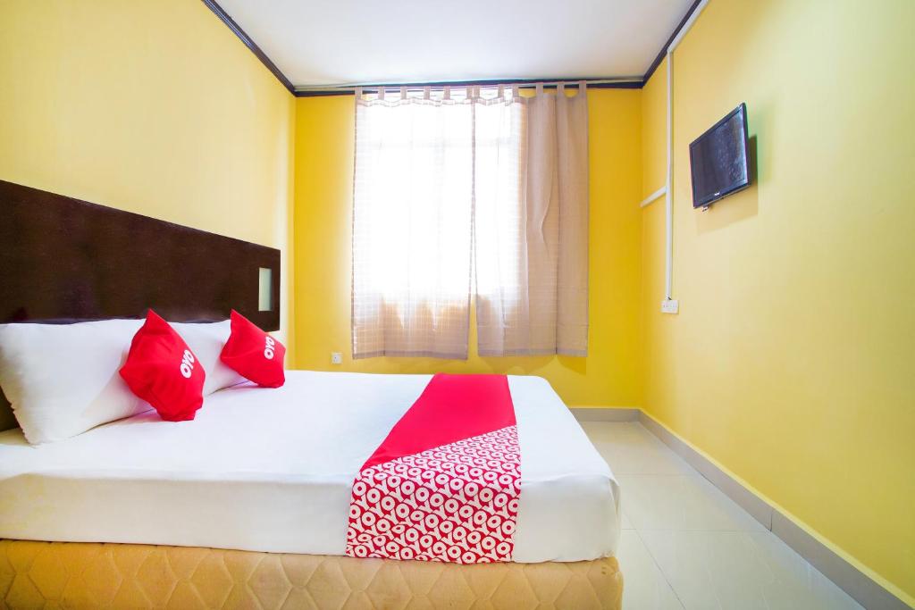 Postel nebo postele na pokoji v ubytování Super OYO 1219 Hotel Bbk