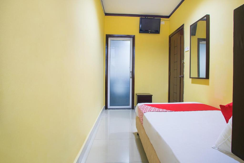 Postel nebo postele na pokoji v ubytování Super OYO 1219 Hotel Bbk