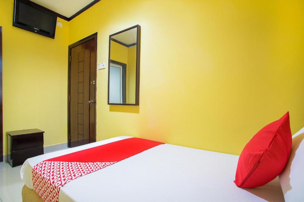 Postel nebo postele na pokoji v ubytování Super OYO 1219 Hotel Bbk
